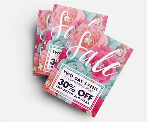 Three Sale flyers staked on a white background. The flyer has a pink and turquoise flower background and reads "Sale. Two day event. 30% off imported flowers."